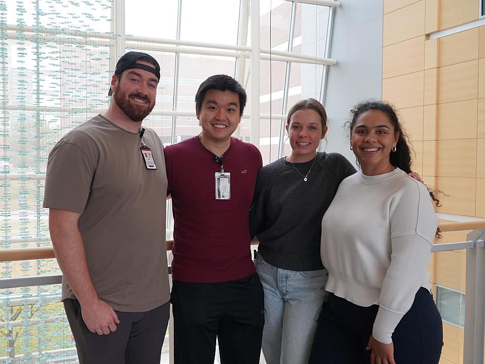 Austen Ivey, Ming Xzang, Grace Bradford, Derek Matheson smile together at the November 2023 Saturday Academy